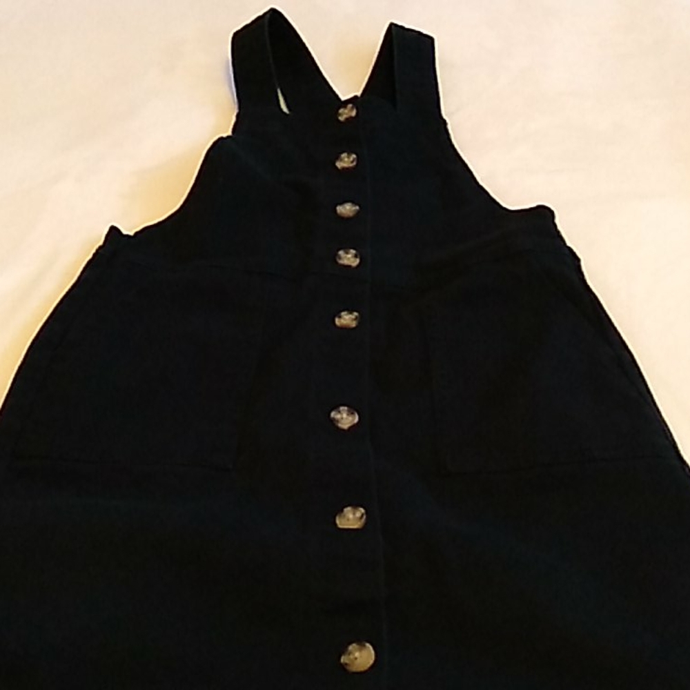 Black overall jean dress.